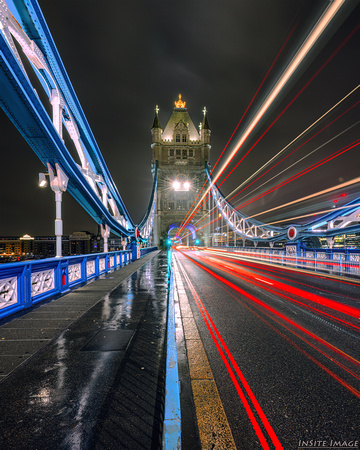Tower Bridge light trails on a foggy night - London