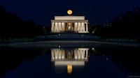 Full Hunter's Moon setting over the Lincoln Memorial