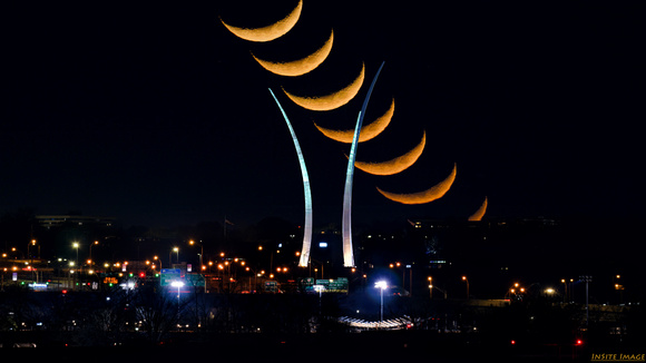 Moonstack of the Crescent Moon setting over the US Air Force Memorial