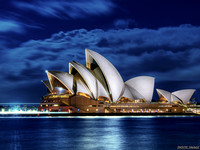 Sydney Opera House lit under a Full moon