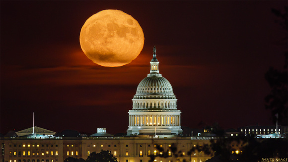 Just-past full Harvest Moon rising above the U.S. Capitol