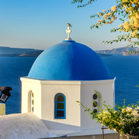 Golden Light with a Blue Dome in Oia