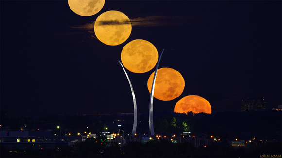 Hunter's Moon / Full moon setting over the US Air Force Memorial