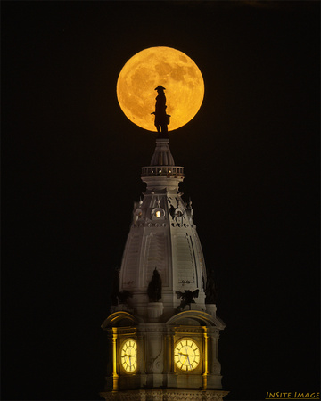 Full Strawberry Moon rising over the William  Penn Statue