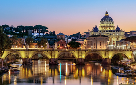 Dusk settles on St. Peter's Basilica and the Tiber River