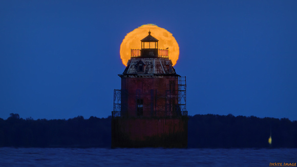 Full Hunters Moon over the Sandy Point Shoal Lighthouse